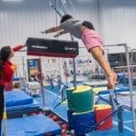 Bar Release Throw Pad in use on gymnastics bars